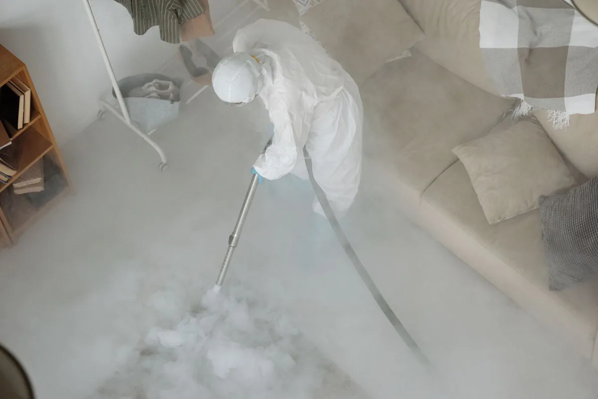Biohazard cleanup technician in protective equipment, Jellico, TN